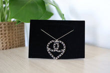 Load image into Gallery viewer, Chanel Black Woven CC Ribbon Heart Pendent SHW
